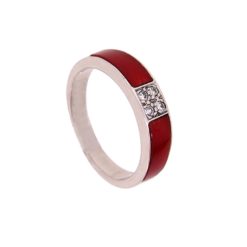 Bague en or blanc, corail rouge et quatre diamants.