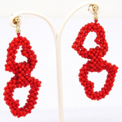boucle d oreille double coeur tissée perle corail rouge med syst poussette or jaune 18k